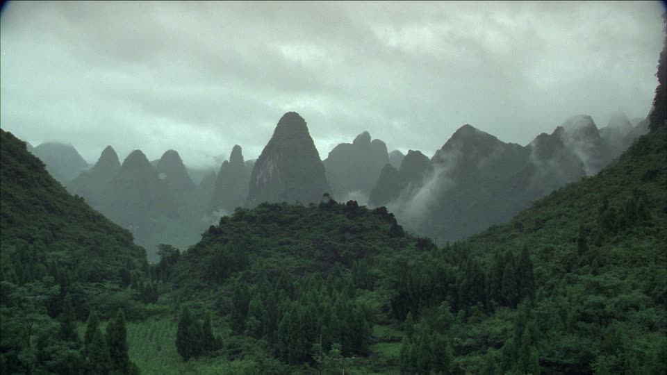 539585262-guangxi-zhuang-waft-of-mist-karst-forest.jpg
